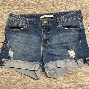 Celebrity pink dark blue Jean shorts.